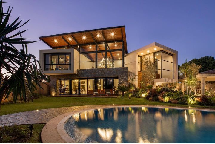 A stunning luxury residence showcasing expansive architecture and impeccable landscaping.